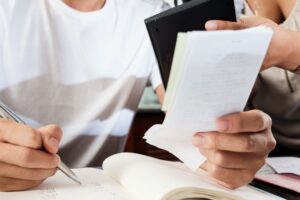 Couple checking bills and calculating monthly expenses